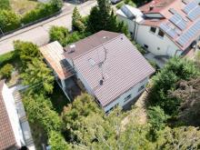 Freistehendes Einfamilienhaus mit Einliegerwohnung, großem Garten und Ausbaupotenzial im Dach Haus kaufen 72411 Bodelshausen Bild klein