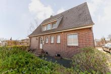 Kapitalanlage in Toplage von Uelsen – Vermietetes Einfamilienhaus mit Einliegerwohnung Haus kaufen 49843 Uelsen Bild klein