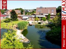 Mehrfamilienhaus * 4 Wohneinheiten * traumhafter Garten * Teichanlagen * 1 Wohneinheit vermietet * Haus kaufen 26835 Schwerinsdorf Bild klein