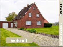 Sehr gepflegtes Einfamilienhaus mit großem Grundstück, Kamin & unverbaubarem Blick ins Grüne! Haus kaufen 26831 Bunde Bild klein