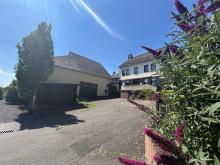 Wohnhaus mit großen Lagerräumen und Parkflächen (für Handwerksbetrieb geeignet) mit Photovoltaik 9 kWp Haus kaufen 56290 Macken Bild klein