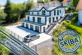 Erstbezug: Moderne Neubau-Erdgeschoss-Eigentumswohnung mit 2 Garagen in Daun-Pützborn Wohnung kaufen 54550 Daun Bild mittel