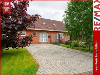 Großzügiges Familienhaus in Toplage von Bunde! 
Mit PV-Anlage, Loggia, Garage & sonniger Terrasse Haus kaufen 26831 Bunde Bild mittel