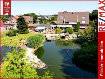 Mehrfamilienhaus * 4 Wohneinheiten * traumhafter Garten * Teichanlagen * 1 Wohneinheit vermietet * Haus kaufen 26835 Schwerinsdorf Bild mittel