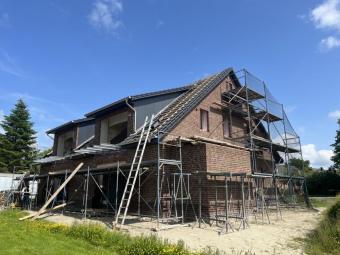 NEUBAU – Bezugsfertige Erdgeschosswohnung mit Photovoltaikanlage, Lüftungsanlage, Carport! Wohnung kaufen 26506 Norden Bild mittel