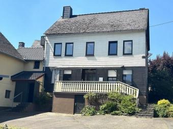 Wohnhaus mit großen Lagerräumen und Parkflächen (für Handwerksbetrieb geeignet) mit Photovoltaik 9 kWp Haus kaufen 56290 Macken Bild mittel