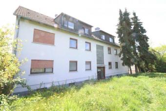 WRS Immobilien - Rockenberg - MFH mit 9 Einheiten + 6 Einzelgaragen - Renditesteigerung auf 4,94 % Gewerbe kaufen 35519 Rockenberg Bild mittel