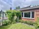 Wohnen auf einer Ebene in Lohe-Rickelshof: Bungalow mit Einliegerwohnung und Wintergarten Haus kaufen 25746 Lohe-Rickelshof Bild thumb