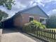 Wohnen auf einer Ebene in Lohe-Rickelshof: Bungalow mit Einliegerwohnung und Wintergarten Haus kaufen 25746 Lohe-Rickelshof Bild thumb